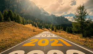 Thumbnail image of a road with 2021 on it, for Routeique blog on trends which will take place in 2022