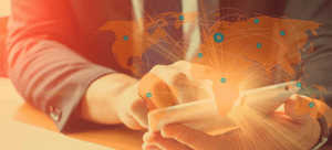 Banner image of tablet in hands, overlaid by globe with connected nodes, for Routeique blog on how IoT will solve logistics problems