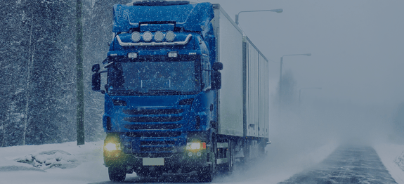 Thumbnail image of truck driving on snowy road, for Routeique blog on cold chain compliance