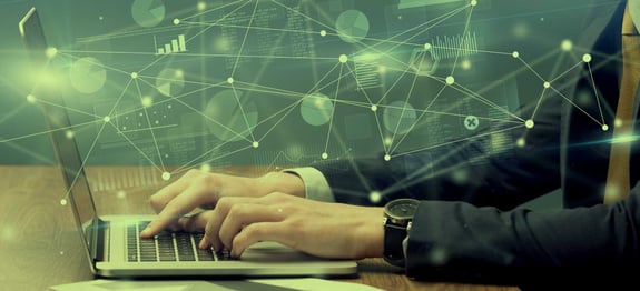 Image of hands on keyboard, a banner for Routeique blog on supply chain management software