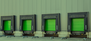 Banner image of green warehouse doors, for Routeique blog on sustainability